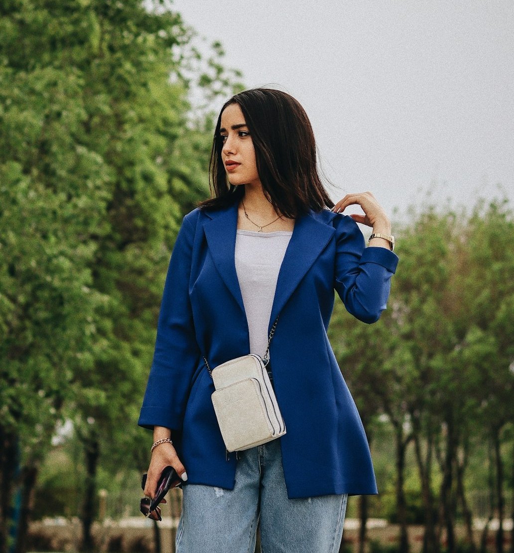 Woman wearing a royal blue blazer with jeans